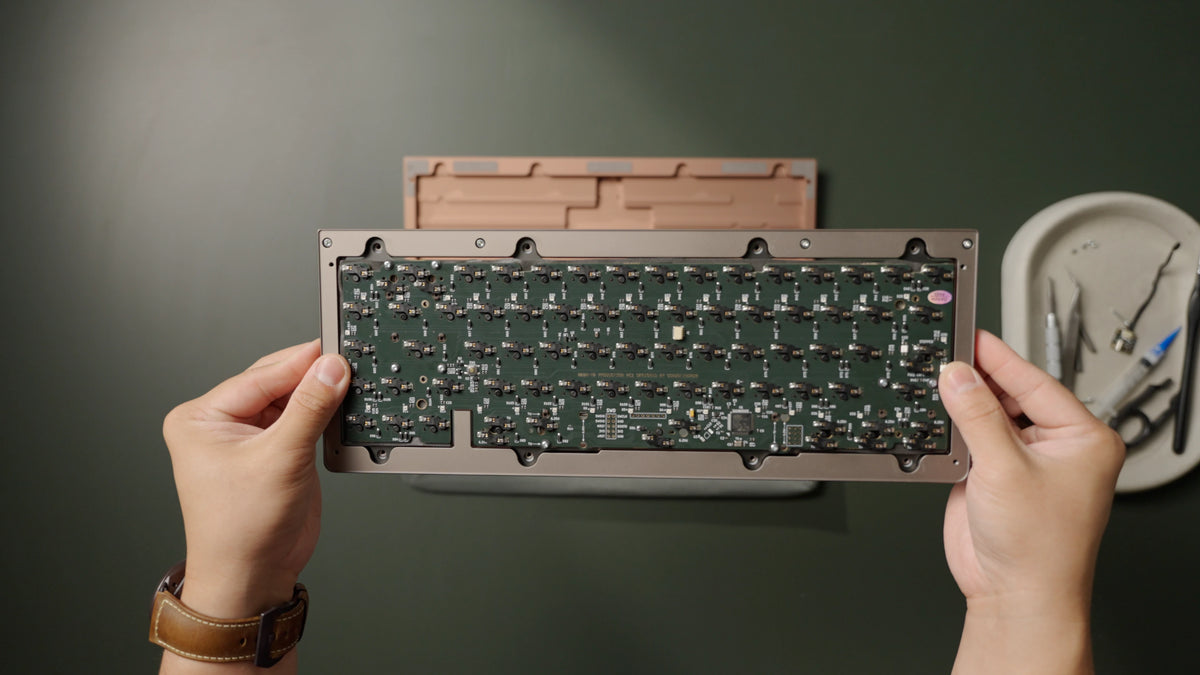 The PCB can only be placed one way, with the cutout matching the blocker on the top case.
