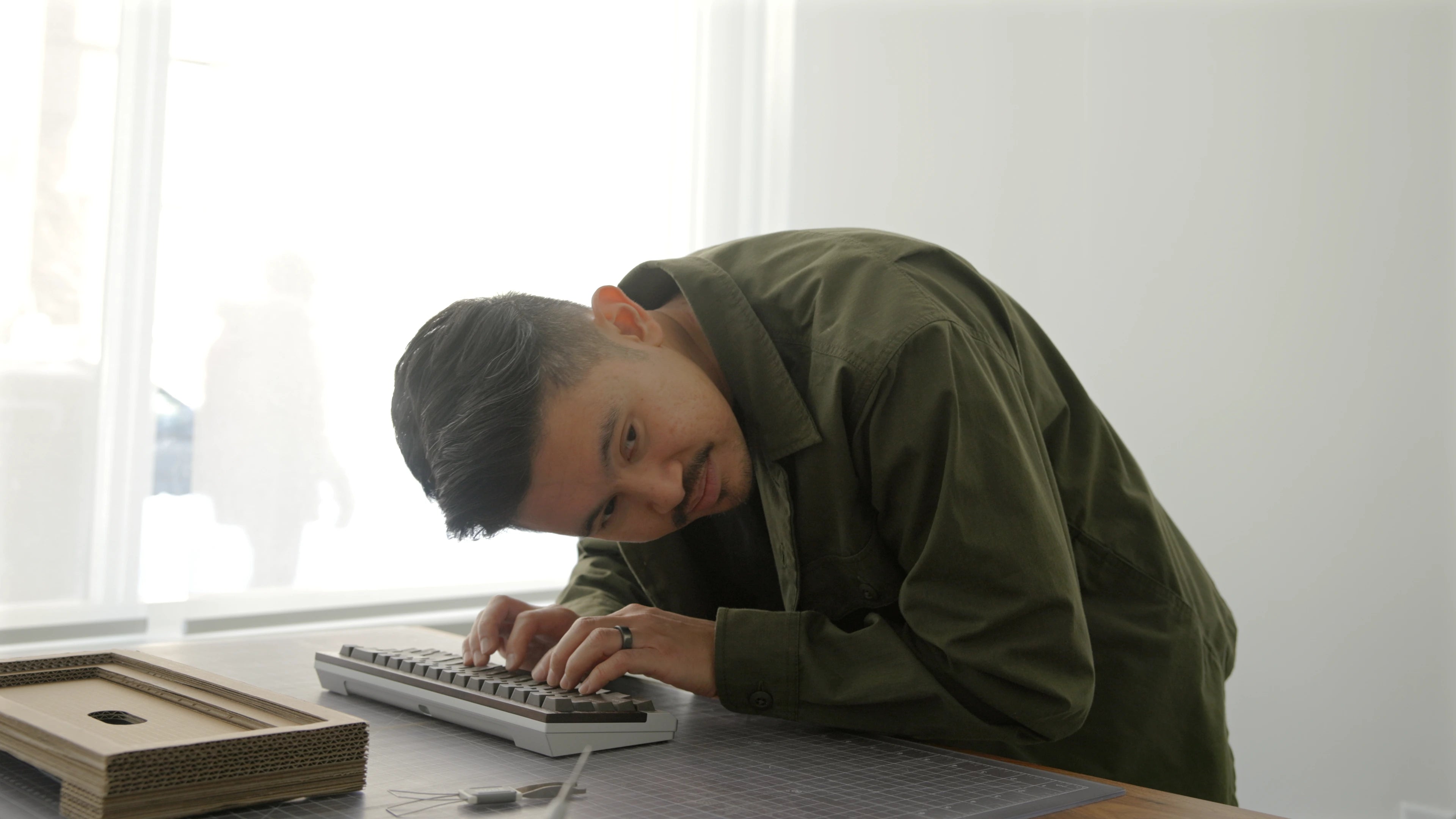 Engineer typing on the Crown Mounting System prototype during Boston testing