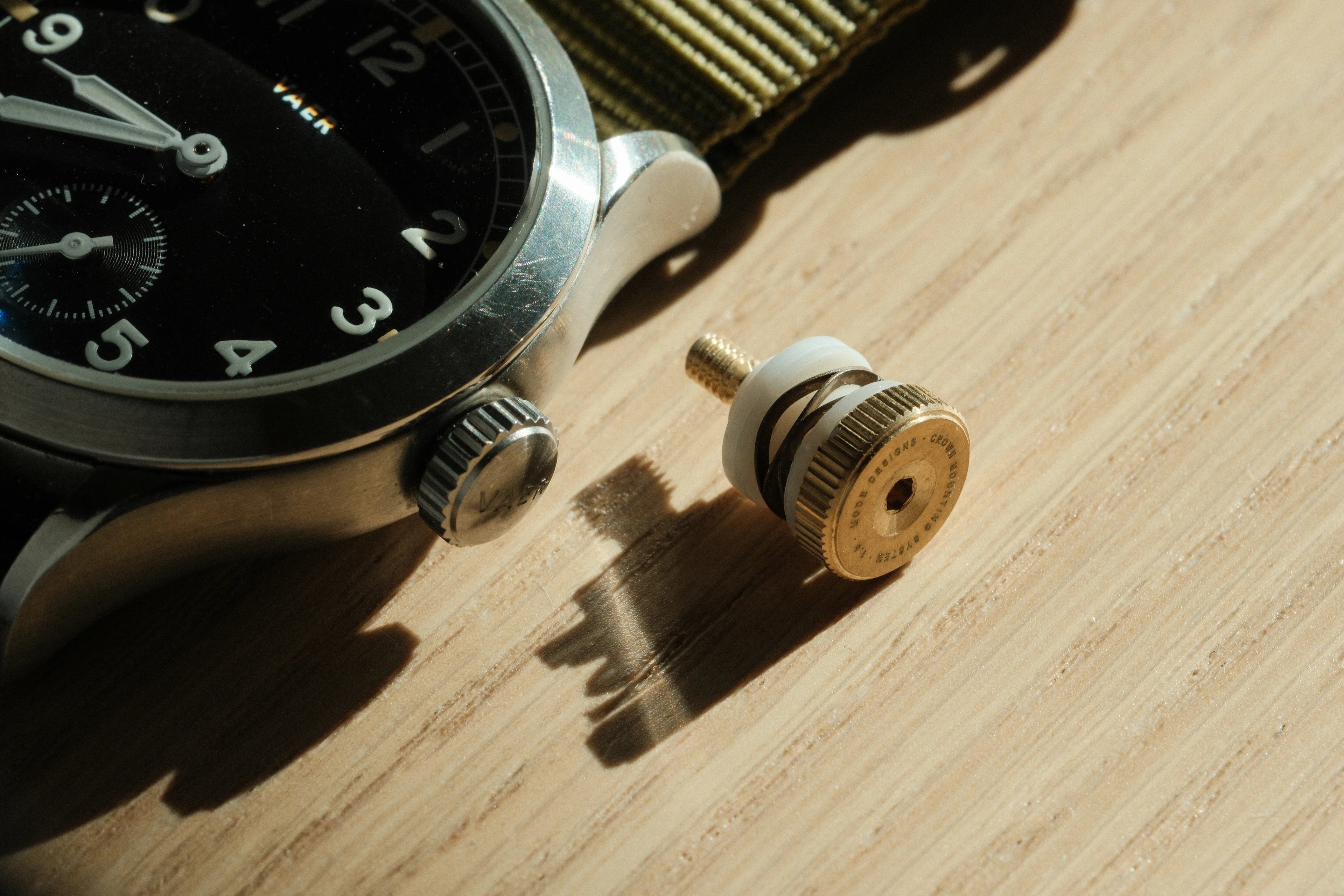 Close-up detail of the crown-inspired fastener at the top of the keyboard