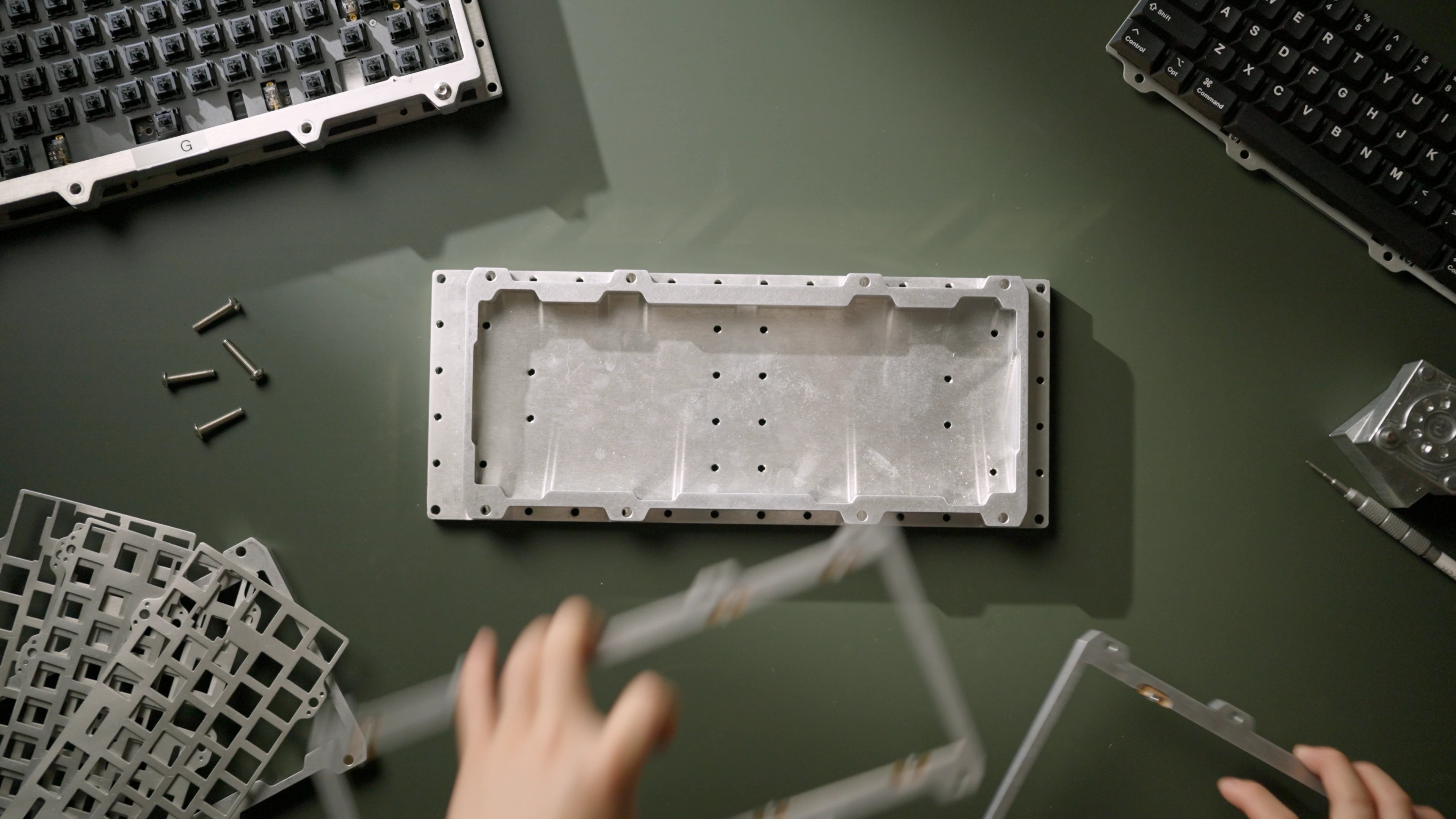 Engineer swapping mount configurations in the modular test board