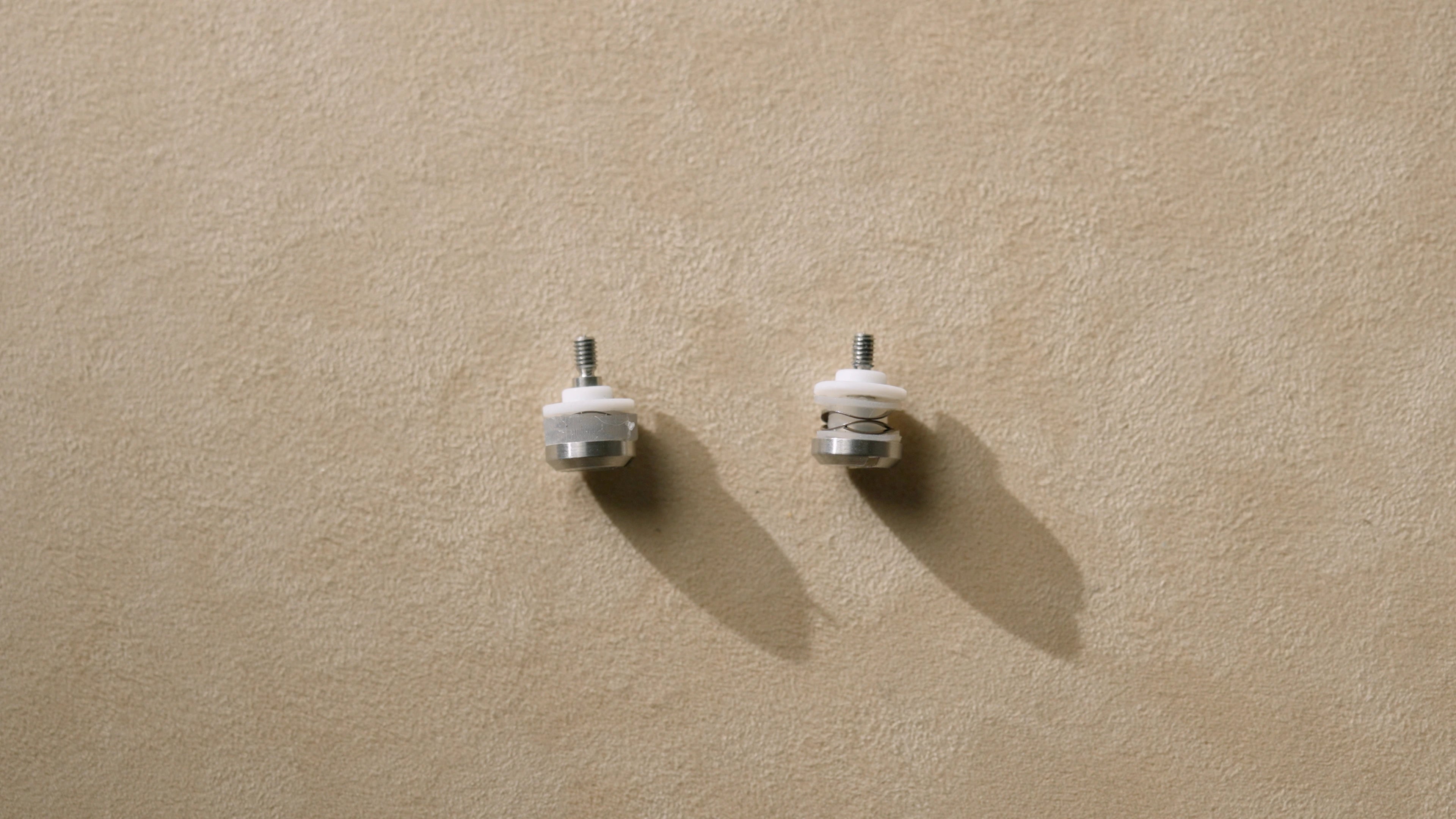 Comparison of over-molded silicone and spool-style silicone damper geometries