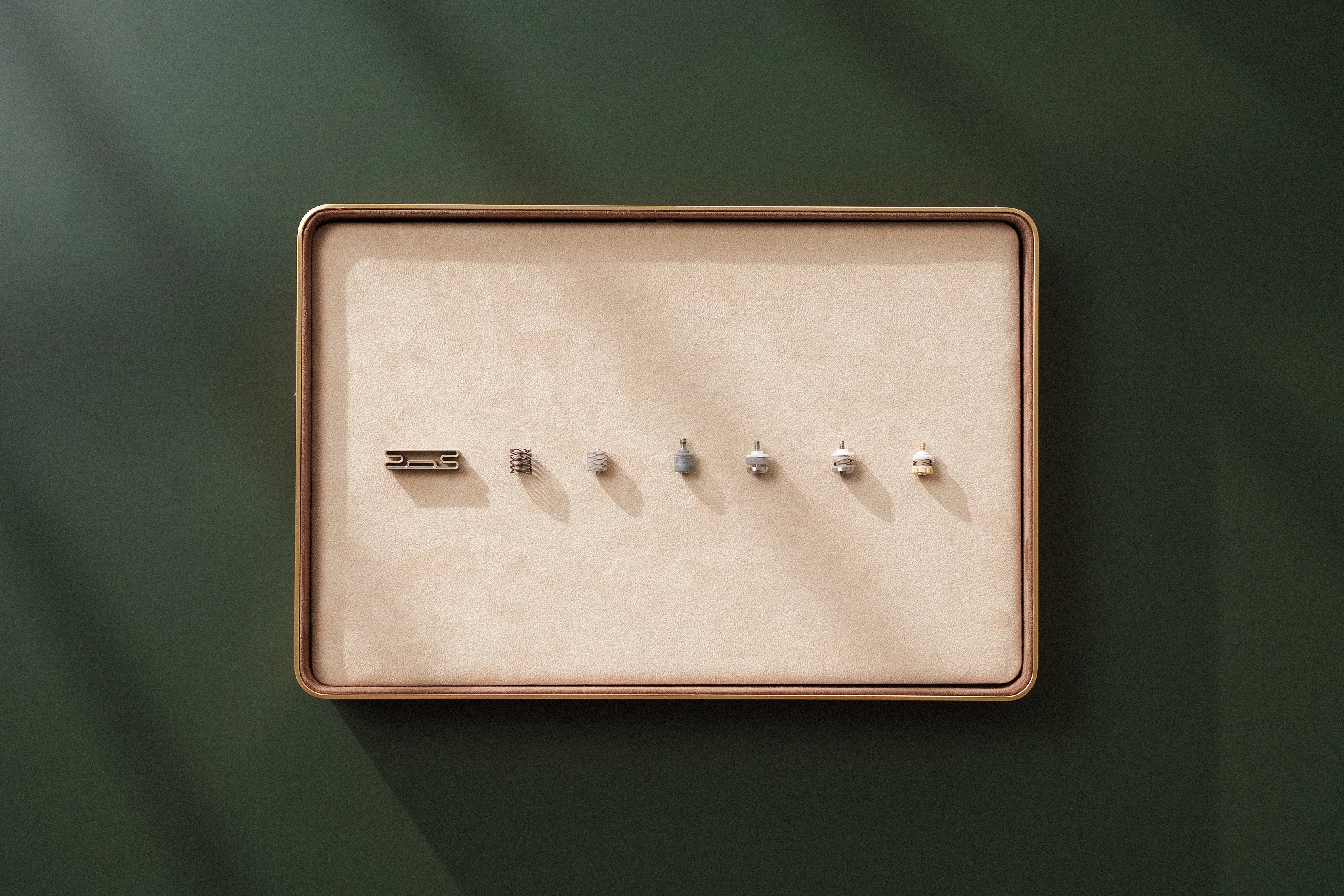 A lineup of Crown Mounting System prototypes, from earliest to final