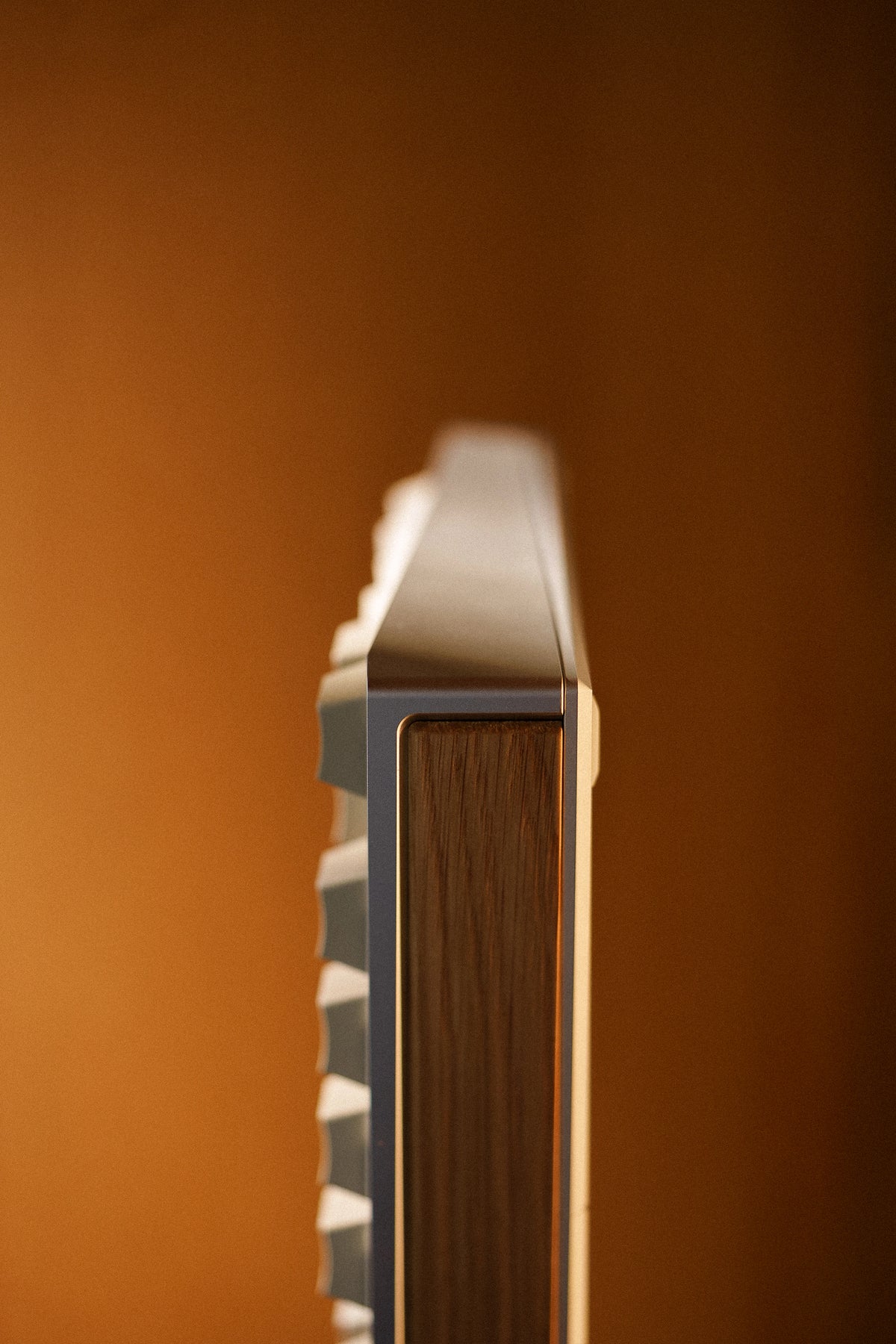 Side profile of a Mode Prologue in Classic Oak showing the oak accent