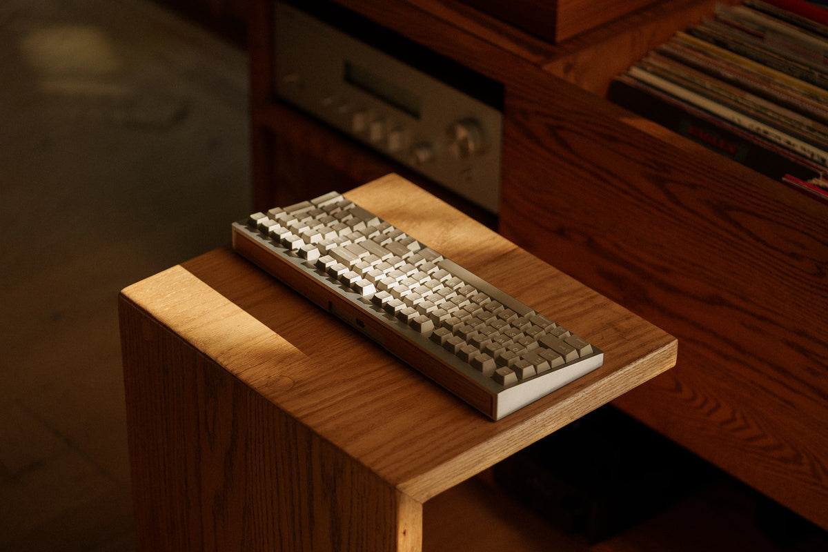 Mode Prologue in Classic Oak on an oak side table beside a hi-fi receiver