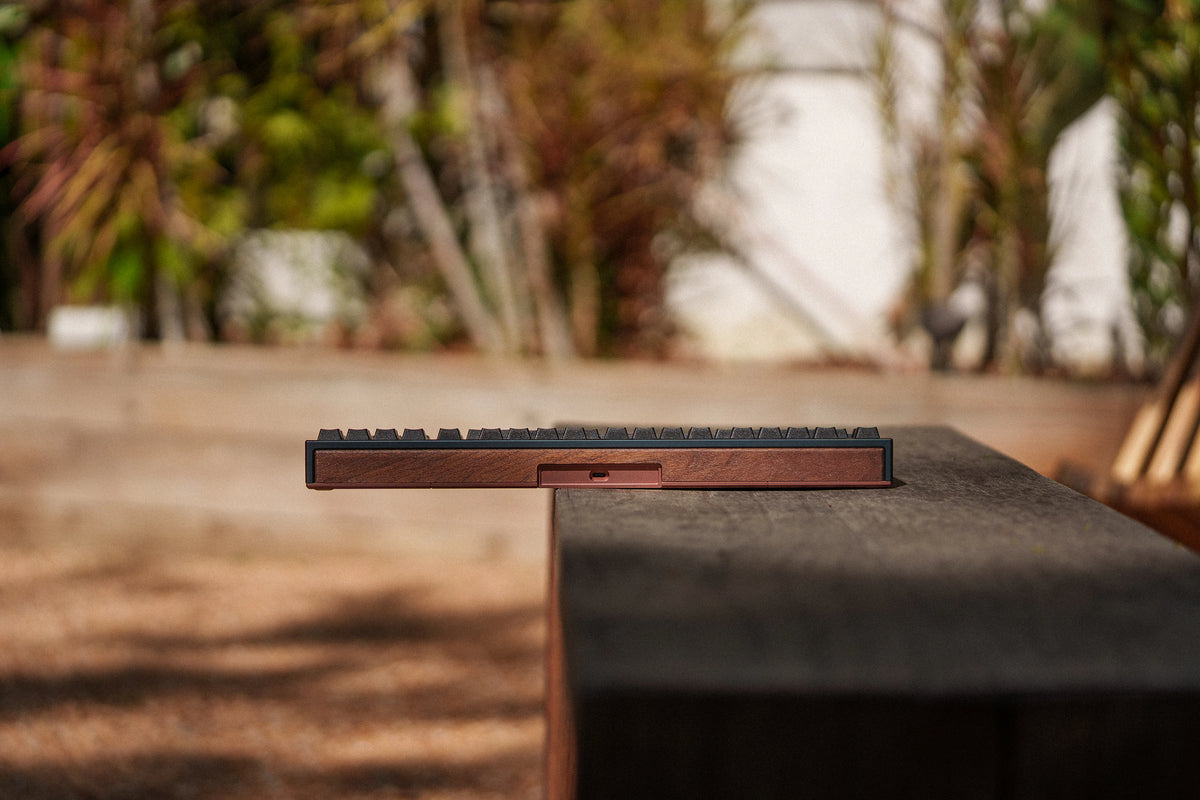 Mode Prologue in Blue Mocha seen from behind on a dark garden bench
