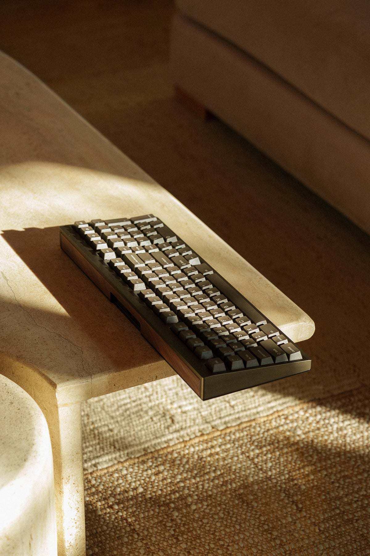 Mode Prologue in Dark Mushroom on a light wood bench in afternoon sun